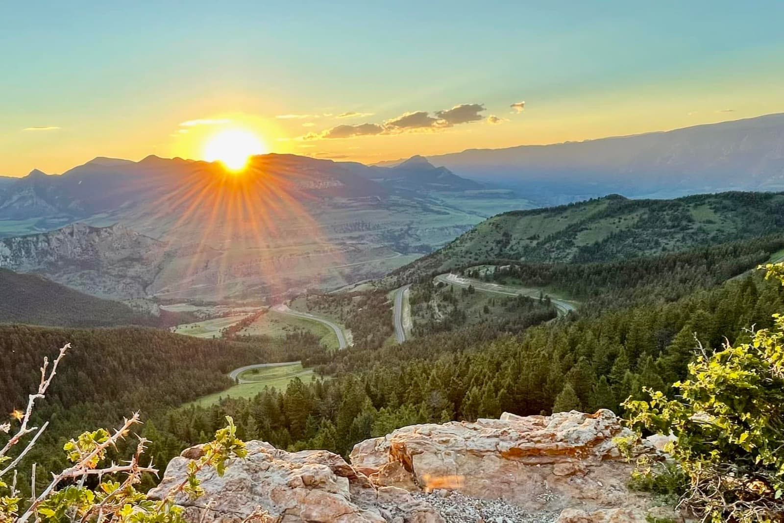 Sunset over the Absaroka Range with the switchbacks of the Chief Joseph Scenic Byway descending into Sunlight Basin, Park County, Wyoming
